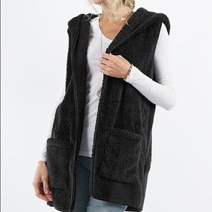 Sleeveless vest with hood and pockets. Super comfy